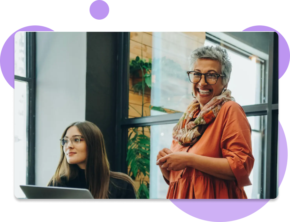 Photo of two women working together